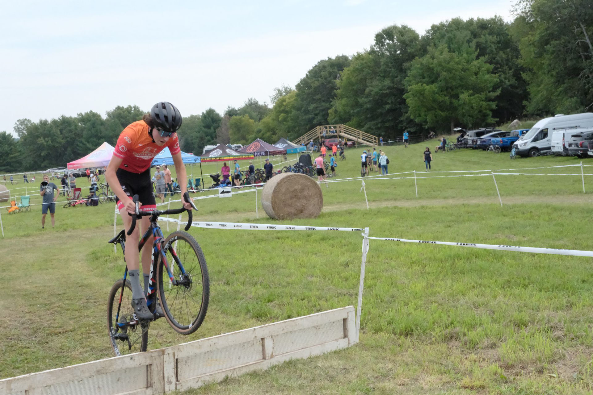 Mountain biker jumping a wood plank